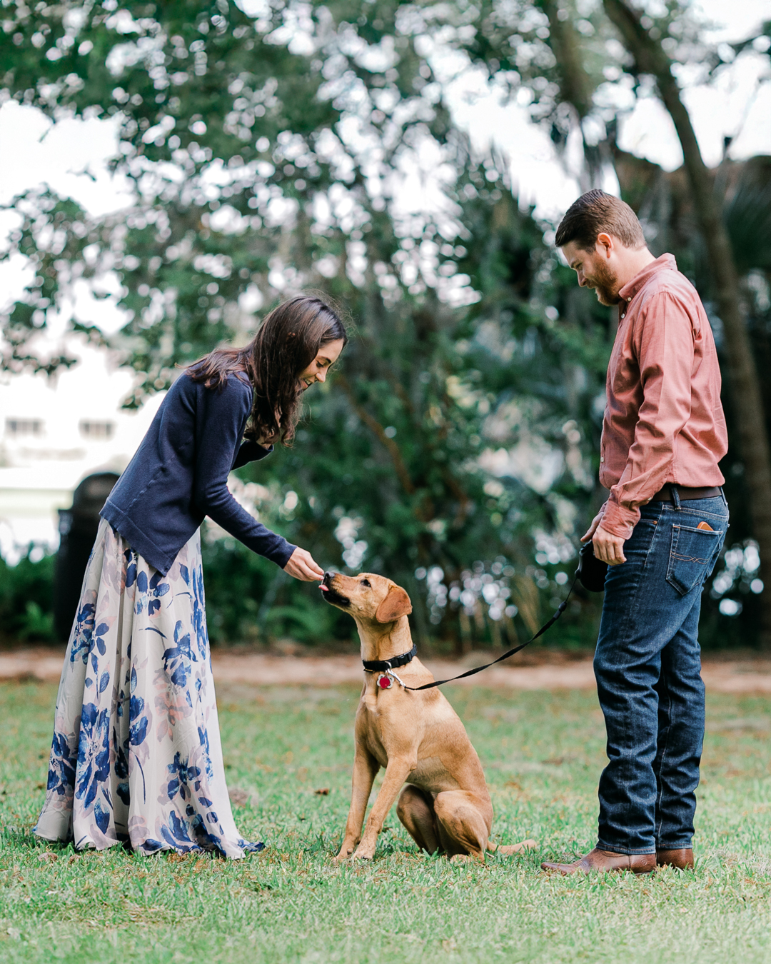 Engaged couple features their dog in engagement photos at Kraft Azalea Garden in Winter Park FL
