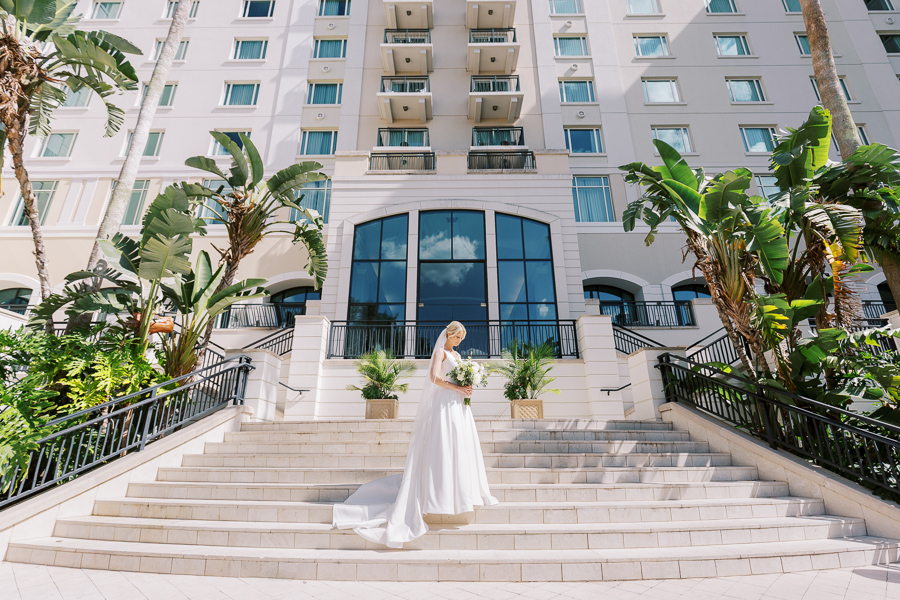 Bride standing in the middle of a grand staircase at a Florida wedding venue