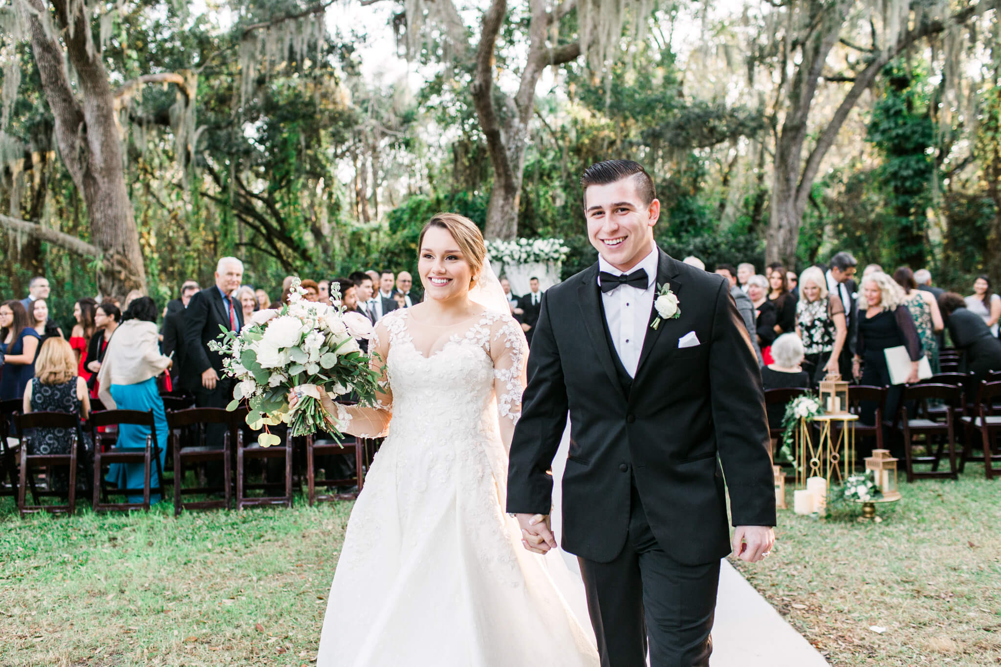bride and groom walk together after getting married at a Florida wedding venue