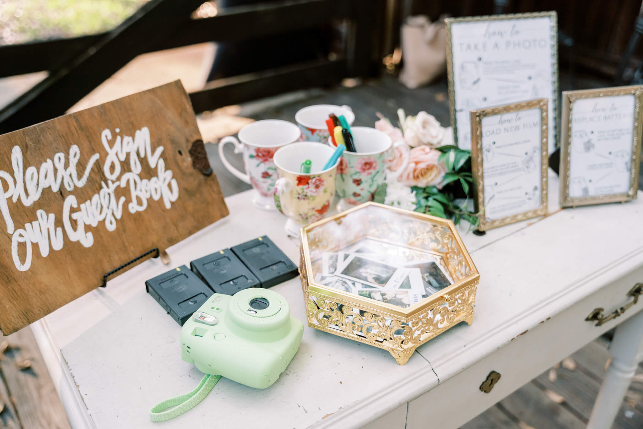 instant camera during cocktail hour at an outdoor wedding venue in Central FL