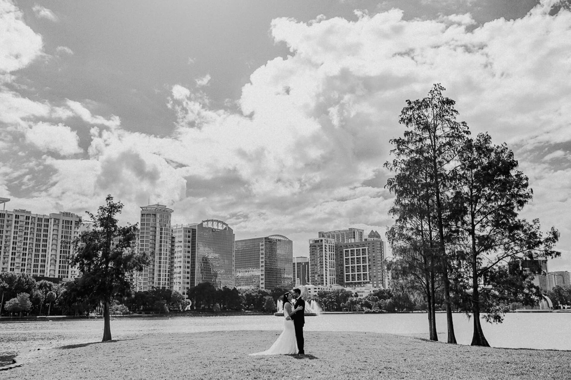 a newlywed couple poses for elopement photos at Lake Eola in Orlando