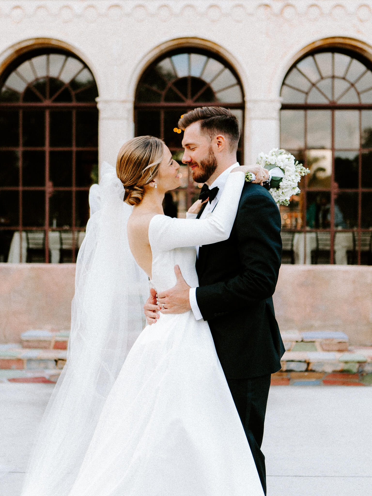 bride and groom posing for wedding portrait at the howey mansion