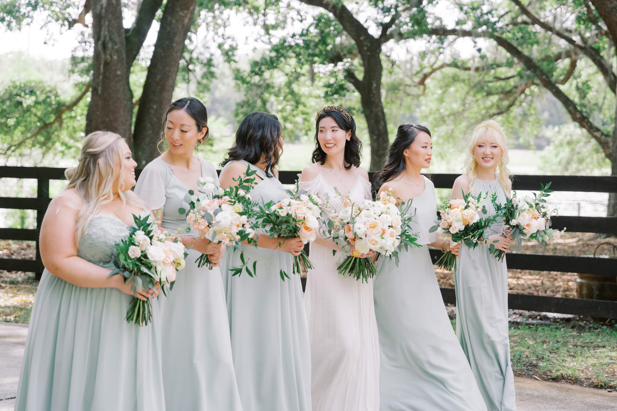 Bride and bridesmaids in light sage