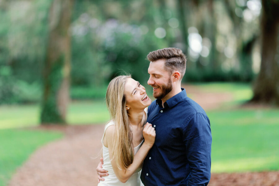 engaged couple laughing together at Bok Tower Gardens