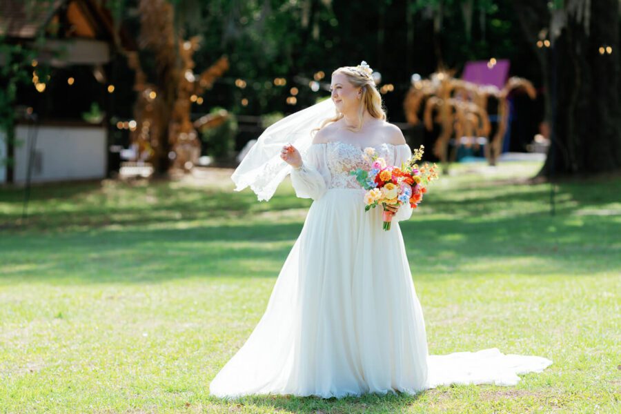 bride posing for wedding portrait at Lake Lucy Estate