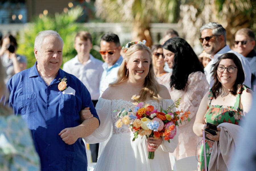 bride walking down the aisle with father