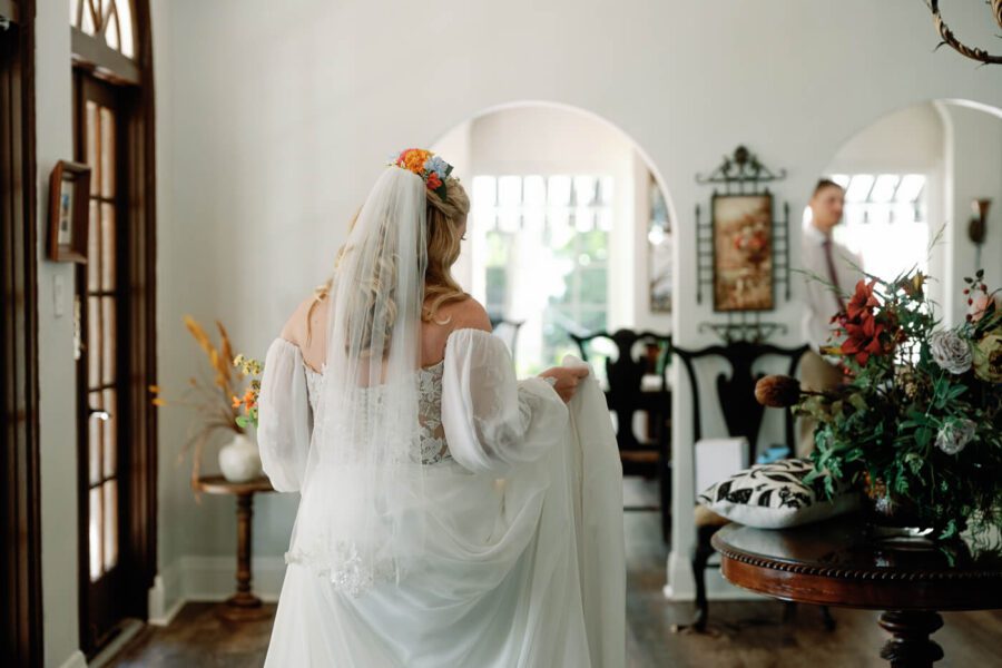 bride walking while holding her dress