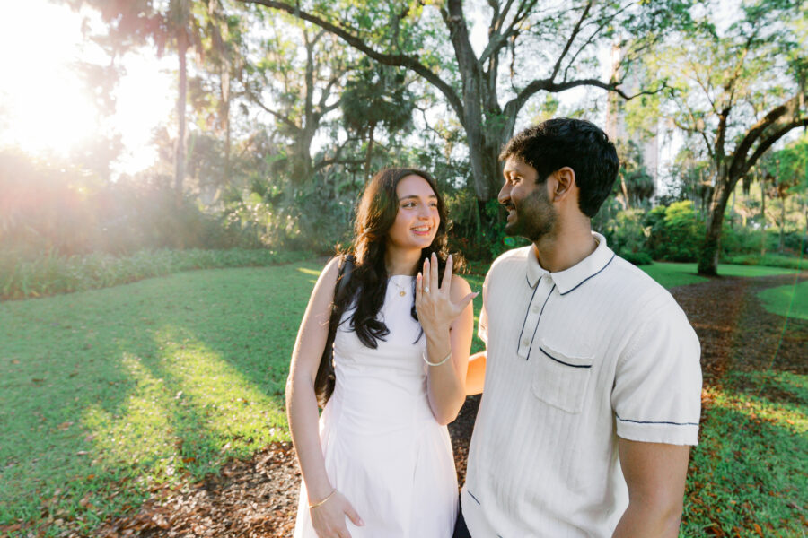 woman shows off engagement ring at Bok Tower Gardens