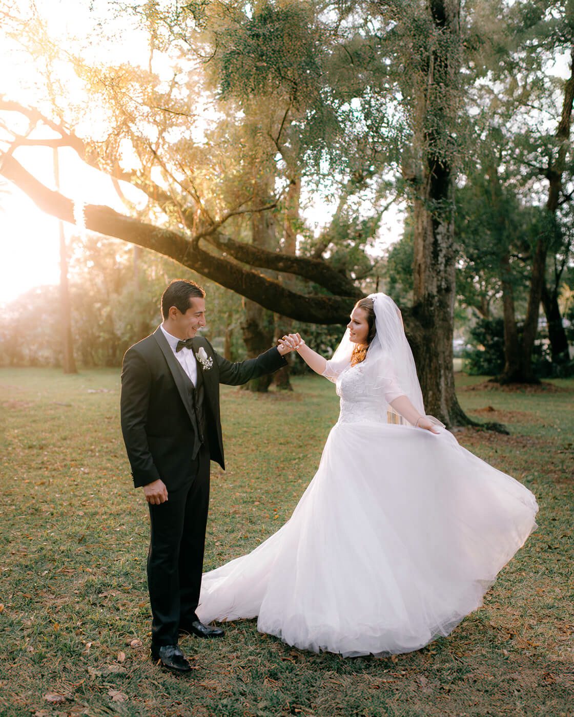 bride and groom posing for photo during golden hour at Garden Villa wedding venue in Orlando, FL