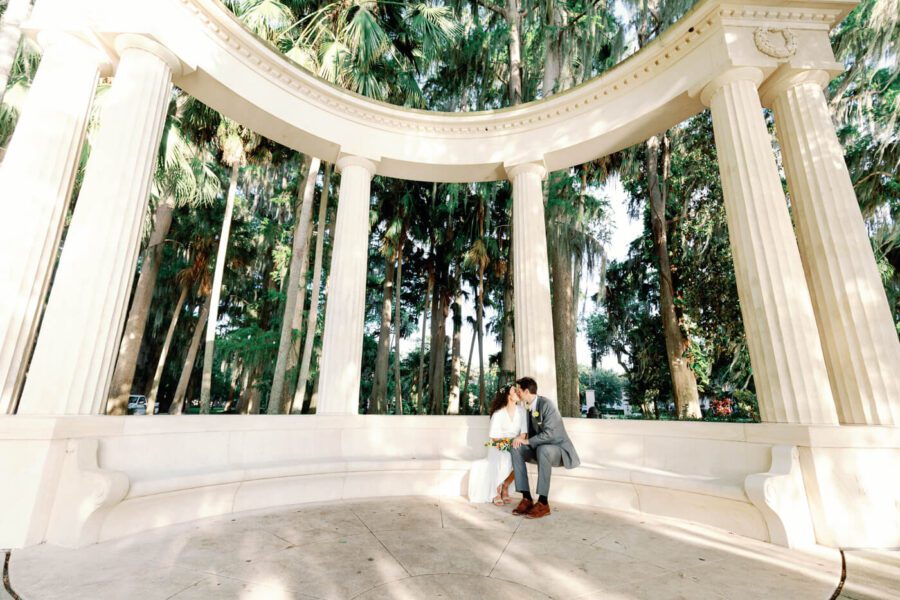 bride and groom kissing at Kraft Azalea Garden, a wedding venue for small weddings and elopements in Orlando